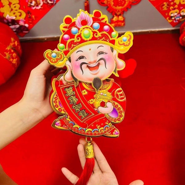 Hình ảnh ông Thần Tài lắc đầu trang trí vào dịp Tết